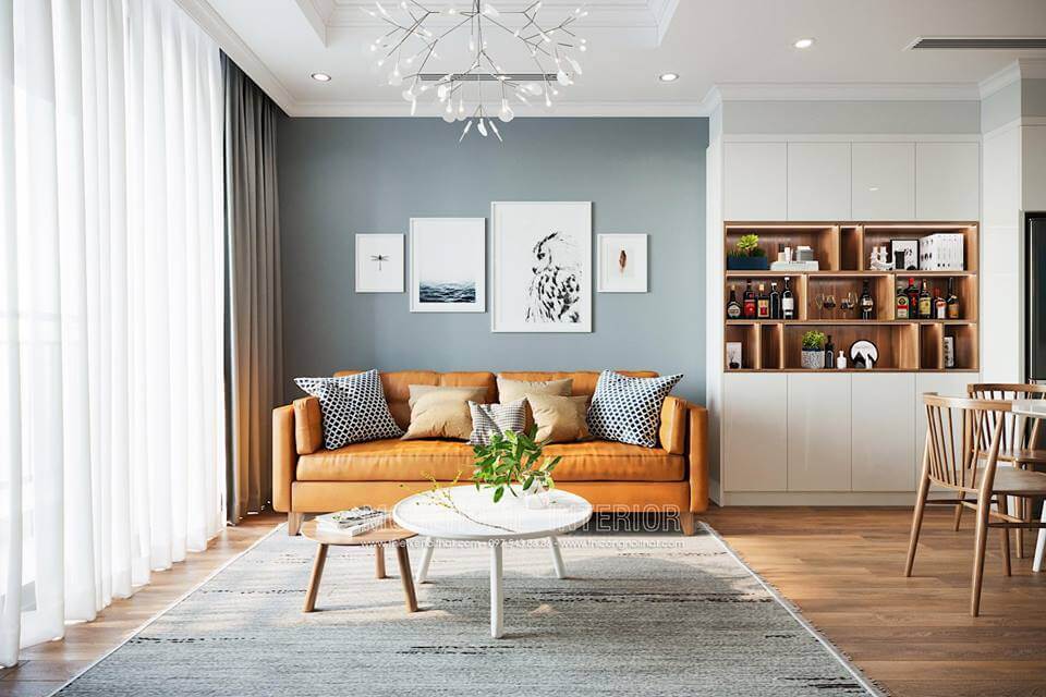 Giấy dán tường màu xám xanh kết hợp các bức tranh decor tạo nên sự hiện đại cho phòng khách. Tổng hợp những mẫu thiết kế phòng khách sang trọng